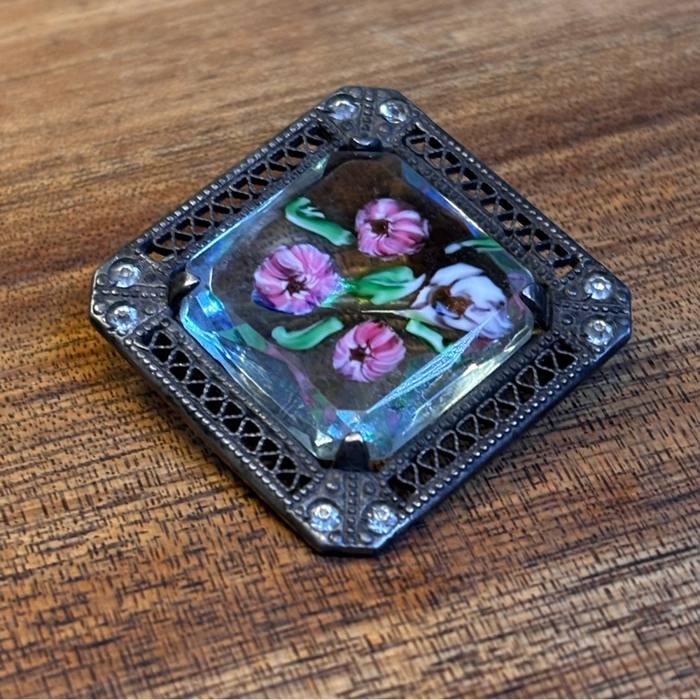 Sterling brooch with reverse painted floral glass inset